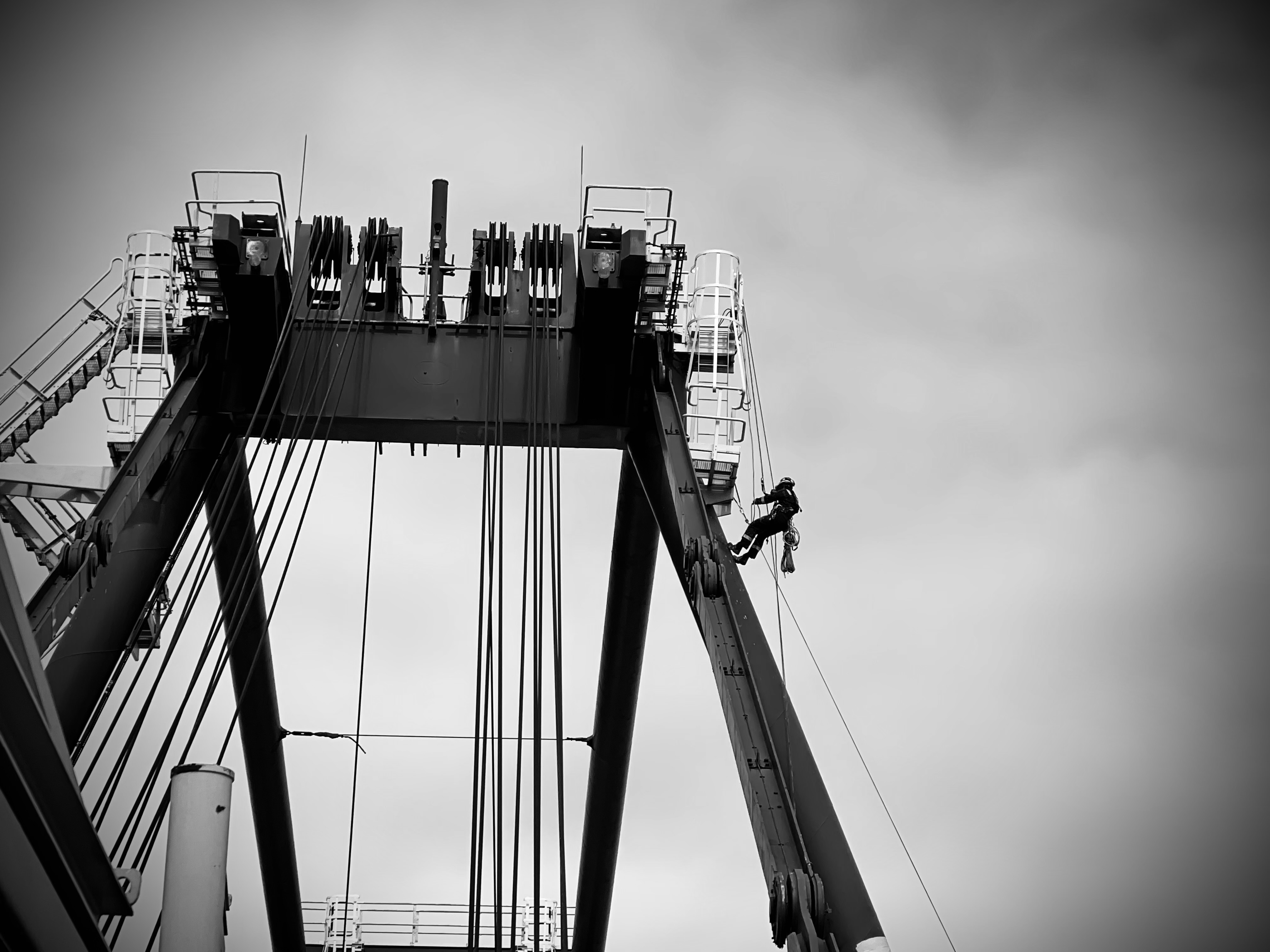 Rope access technician working on a large metal structure